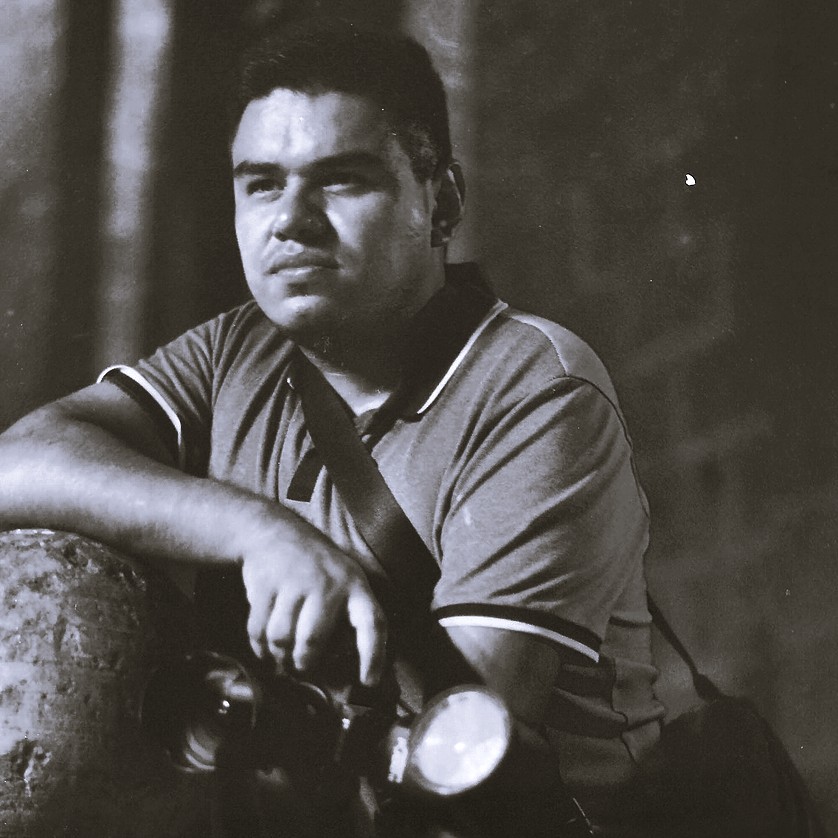 Jorge Exiga photographing with professional camera setup