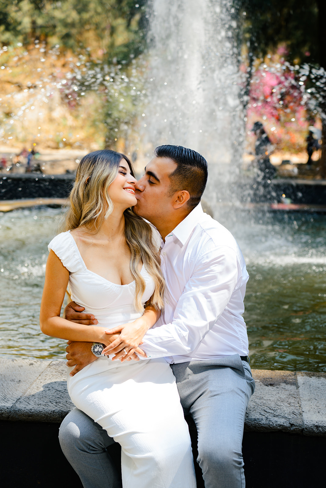 Romantic couple kissing on the beach at sunset